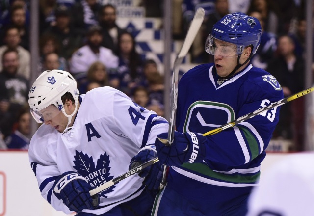 Vancouver Canucks Bo Horvat and Morgan Rielly of the Toronto Maple Leafs