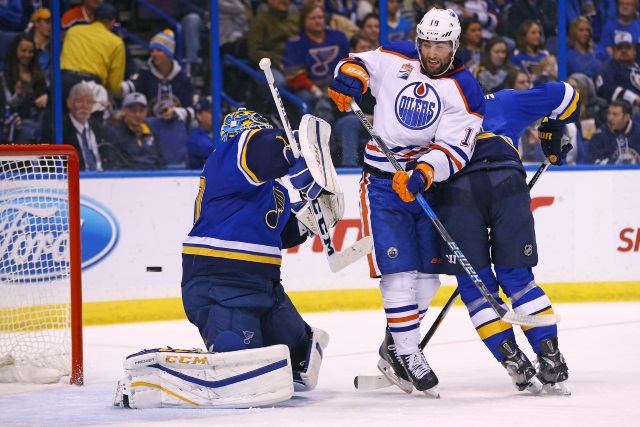Patrick Maroon of the Edmonton Oilers and Carter Hutton of the St. Louis Blues