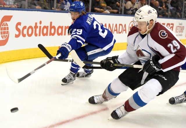 William Nylander of the Toronto Maple Leafs and Nathan MacKinnon of the Colorado Avalanche