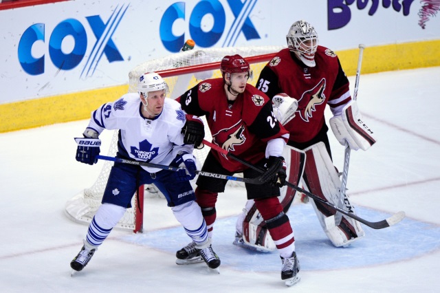 Oliver Ekman-Larsson of the Arizona Coyotes and Leo Komarov of the Toronto Maple Leafs