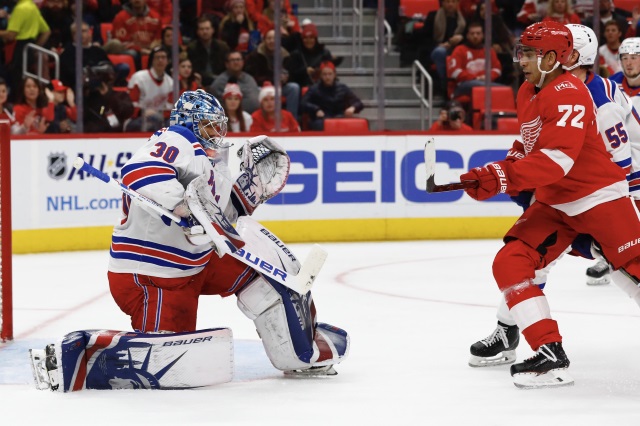 Andreas Athanasiou of the Detroit Red Wings and Henrik Lundqvist of the New York Rangers.