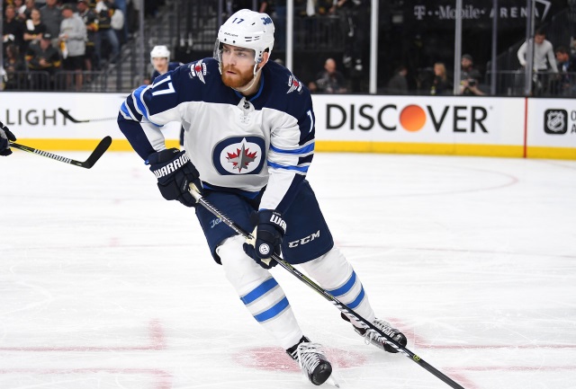 The Winnipeg Jets have signed Adam Lowry to a three-year contract.
