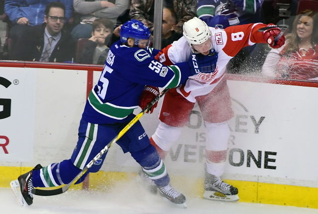The Vancouver Canucks have traded Alex Biega to the Detroit Red Wings.