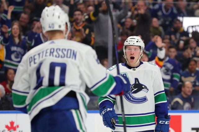 Vancouver Canucks GM on salary cap issues. Notes on Elias Pettersson, Quinn Hughes and Brock Boeser.