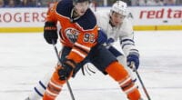 Ryan Nugent-Hopkins and Ken Holland of the Edmonton Oilers do a dance.