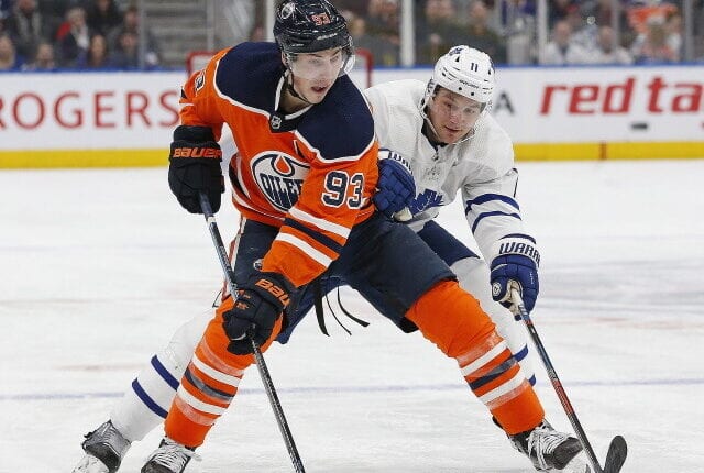 Ryan Nugent-Hopkins and Ken Holland of the Edmonton Oilers do a dance.