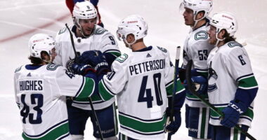 Travis Hamonic doesn't opt-out. The Vancouver Canucks officially sign restricted free agents Elias Pettersson and Quinn Hughes.