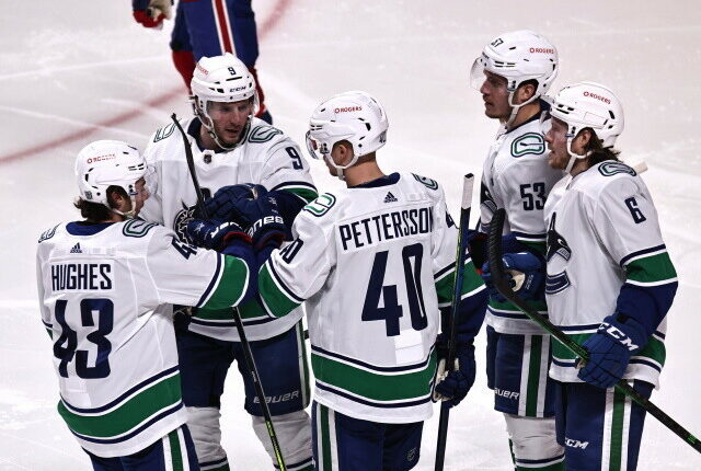 Travis Hamonic doesn't opt-out. The Vancouver Canucks officially sign restricted free agents Elias Pettersson and Quinn Hughes.