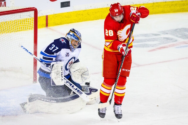 Should the Winnipeg Jets keep Connor Hellebuyck for the season? The Flames are still trying to extend Elias Lindholm.