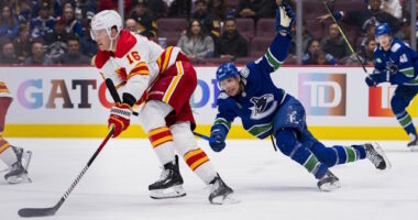 Sources are saying the Vancouver Canucks are looking to make some moves and could be eyeing two Calgary Flames defensemen.